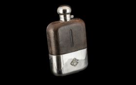 A Jumbo Size Gentleman's Silver Plated Hip Flask, with a leather clad body, maker's name to top J