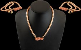 18ct Gold - Pink Coral Beaded Necklace. Marked 750 to Flower Bar. Pleasing Colour. 17 Inches - 42.