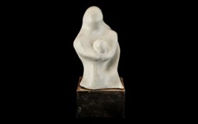Henry Moore Style Figure raised on a wooden block, measures approx 12" tall.