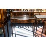 A Mid 20th Century Ladies Writing Desk, with a grey leather tooled top,