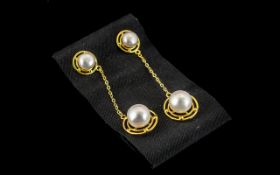 Cultured Pearl Long Drop Earrings, single fresh water white pearls set within circular,