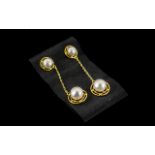 Cultured Pearl Long Drop Earrings, single fresh water white pearls set within circular,