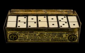 Advertising Interest early 20th century domino set in original box, made by E.M. patent number 8436.