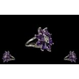 Deep Purple Amethyst Cluster Ring, eight marquise cut amethysts, totalling 4cts, form an elongated,