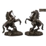 Pair of French Antique Bronze Marly Horse Groups, after Coustou, depicting a rearing horse being