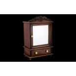 Small Mahogany Cabinet with mirrored door and drawer beneath, decorative fretwork to top,