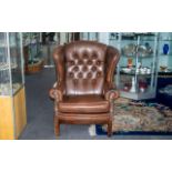 Gents Wing Back Chesterfield Armchair in brown, with lovely age patination, wear to arms and small