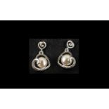 White Fresh Water Pearl Heart Shaped Drop Earrings, an openwork heart, set at an angle,