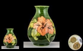 William Moorcroft Signed Globular Shaped Vase ' Coral Hibiscus ' on Green Ground.