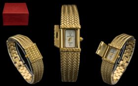 Ladies Bracelet Watch by Anne Klein, decorative gold tone strap with concealed watch face,