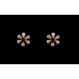 Floral Shaped Earrings with Diamond Chips and ruby centre stones, for pierced ears.