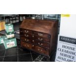 A Walnut George III Bureau with full front, fitted interior with various pigeon holes, central
