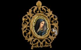 Ormalu framed Plaque of the Madonna. On stand, measures 11" tall.