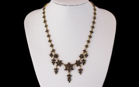 An Antique 19th Century Garnet Fringe Necklace, set in unmarked 9ct gold,