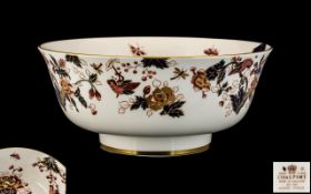 Large Coalport Porcelain Footed Bowl decorated in the Imari palette, highlighted in gilt,