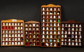 Collection of Thimbles displayed in four wooden cases, approx. 150 in total.