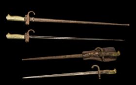 Two Antique French Bayonets in original scabbards comprising Model 1886 Epee and Model 1878