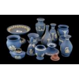 Collection of Wedgwood Blue Jasper, comprising a footed dish, a table lighter, a candle holder,