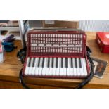 Accordion 'Pearl River' in red marble effect finish, with black trim and padded shoulder strap.