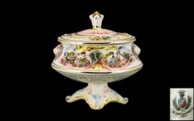 Capodimonte Oval Lidded Bowl, raised on pedestal, decorated with cherubs, lions and floral design.