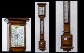 A Late Victorian Oak Stick Barometer makers Adie, Broadway Works, Westminster. Large mercury tube