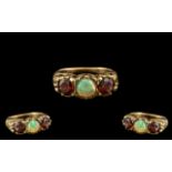 Antique Period - Attractive 9ct Gold 3 Stone Opal and Garnet Set Dress Ring - In a Gallery Setting.