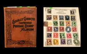 Very old Stanley Gibbons Improved stamp album No. 0 well filled with stamps from around the world.