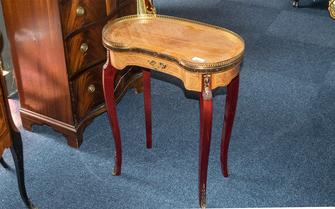 A Small French Reproduction Kidney Shaped Ormolu Mounted Side Table terminating on cabriole legs. - Image 2 of 2