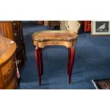 A Small French Reproduction Kidney Shaped Ormolu Mounted Side Table terminating on cabriole legs.