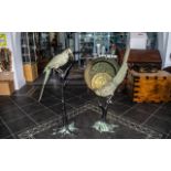 Pair of 20th Century Bronze Patinated Figures of Exotic Parrots (possibly Kakapo) perched on
