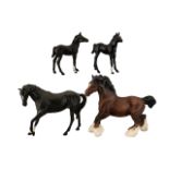 Collection of Four Beswick Horses comprising two black matt 'Black Beauty Foal' Model No.