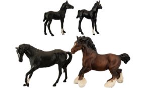 Collection of Four Beswick Horses comprising two black matt 'Black Beauty Foal' Model No.