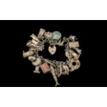 A Vintage Sterling Silver Charm Bracelet - Loaded with 25 Silver Charms,