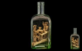 Antique French Whimsy Bottle, good thick glass, housing men drinking and playing cards at a table.