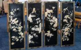 Set of Four Black Lacquered Chinese Wall Panels depicting flowers and birds; 36 inches (90cms) x