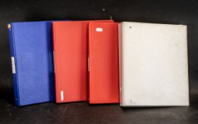 Set of four binders containing stamps from all over the world.