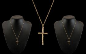 A 9ct Gold Cross Attached to a 9ct Gold Chain. Both Marked for 9ct Gold.