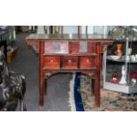 Chinese Antique Elm Altar Table of small proportions, with a red lacquered finish of typical Chinese