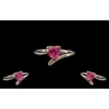 Ladies Silver Ring set with a pink heart shaped stone of about 1ct;