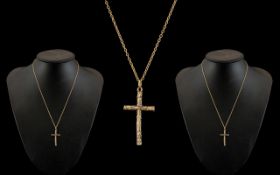 A 9ct Gold Cross Attached to a 9ct Gold