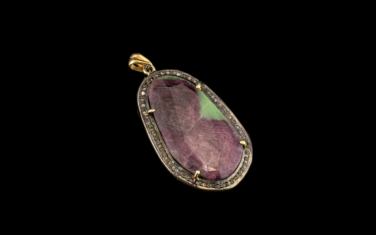 Carved Jade Pendant mounted on gold. 3.5