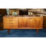 Swedish Designer Teak Credenza with a bank of four drawers and two cupboards,