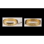 9ct Gold and Metal Core Hinged Bangles. Marked 9ct and Metal Core.