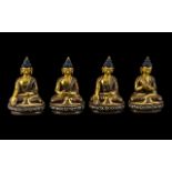 Set of Four Small Seated Bronze Buddhas with different hand positions,