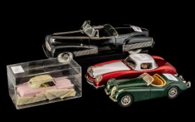 Four Various Vintage Toy Cars comprising Urago- Jaguar XK 120, 7 inches (17.