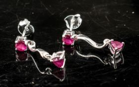 Pair of Ruby Drop Earrings, the quirky designer style having a round cut ruby at the top,