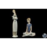 Two Lladro Figures, a seated Ballerina and Young Girl with Lamb, No. *4505. Tallest 11".