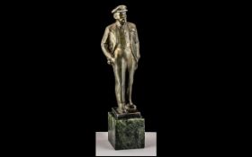 Russian Bronzed Figure of Lenin, square base with Russian script, raised on a green marble socle.