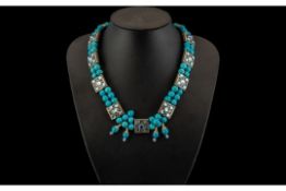 Turquoise Coloured Stone Bead Necklace in two strands, with interlocking silvered metal spacers