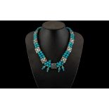 Turquoise Coloured Stone Bead Necklace in two strands, with interlocking silvered metal spacers
